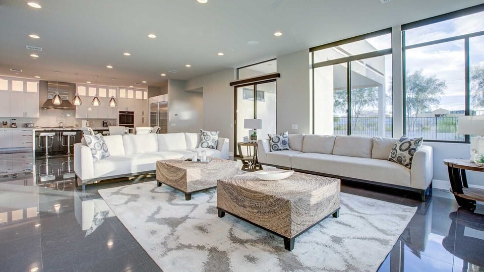 Large comfy couches in the TV room w/ natural lighting off the kitchen 