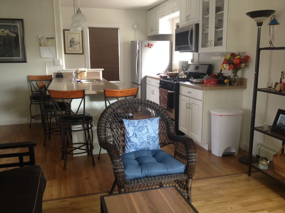 Living room has two wicker chairs