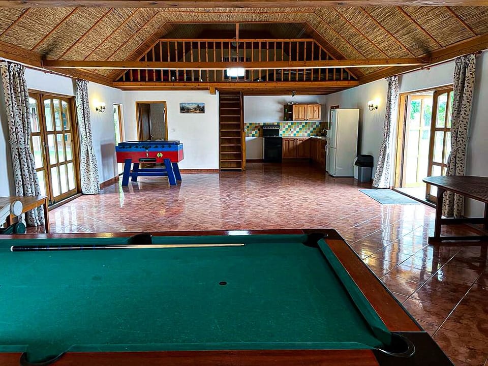 Pool house with kitchen, toilet with shower, staircase to mezzanine floor 