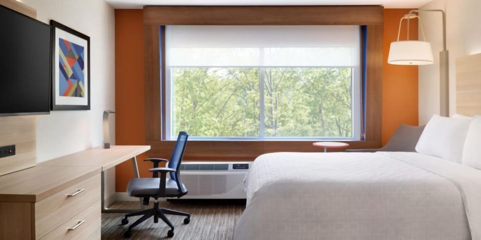 Desk, laptop workspace, blackout drapes, iron/ironing board
