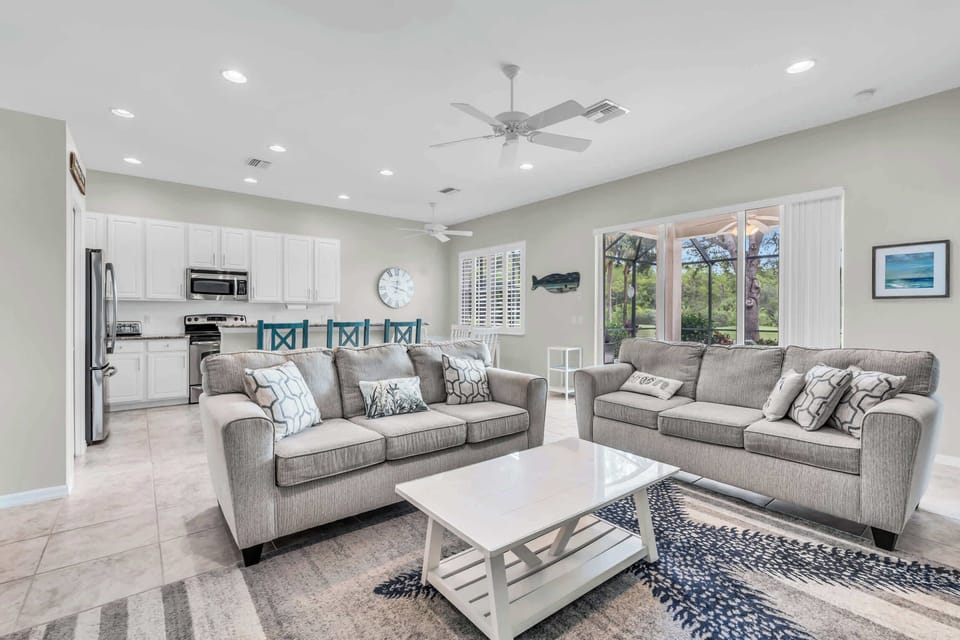 The family room has 2 sofas and a large coffee table