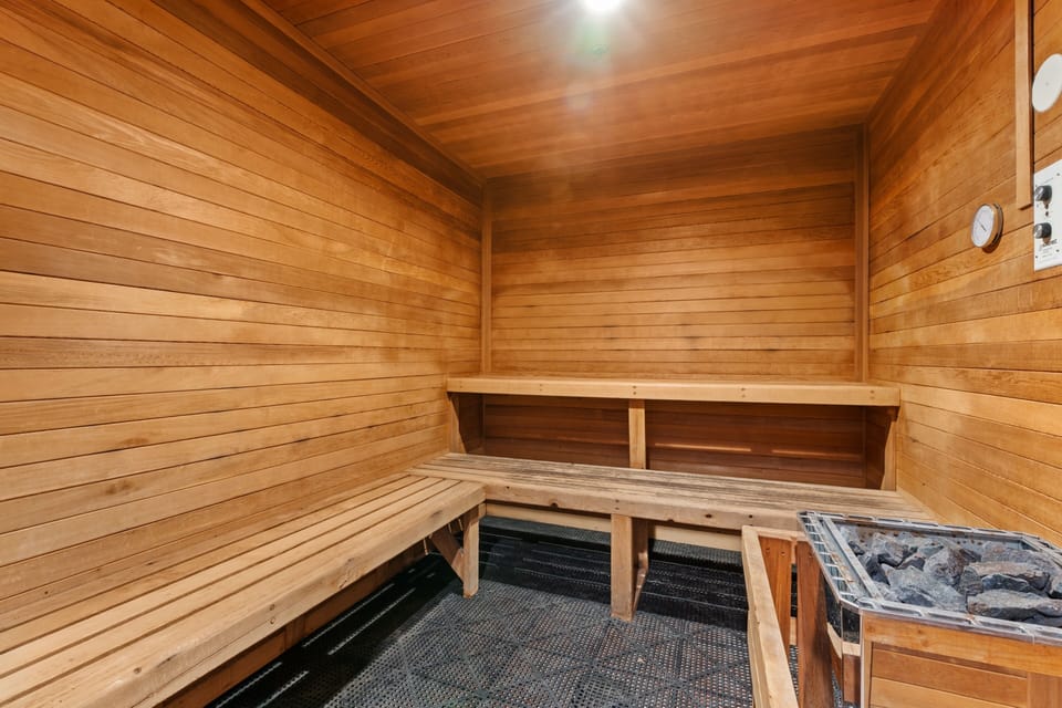 Step into the sauna retreat, where warm cedar walls and tiered bench seating invite you to unwind after a day of adventure. Let the soothing heat melt away tension as you relax in this tranquil wellness space.