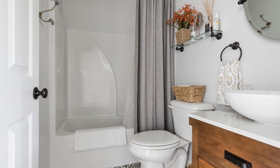 Small tub/shower bathroom. 