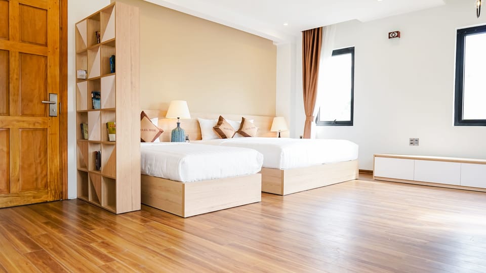 Deluxe Suite | Premium bedding, desk, laptop workspace, blackout drapes