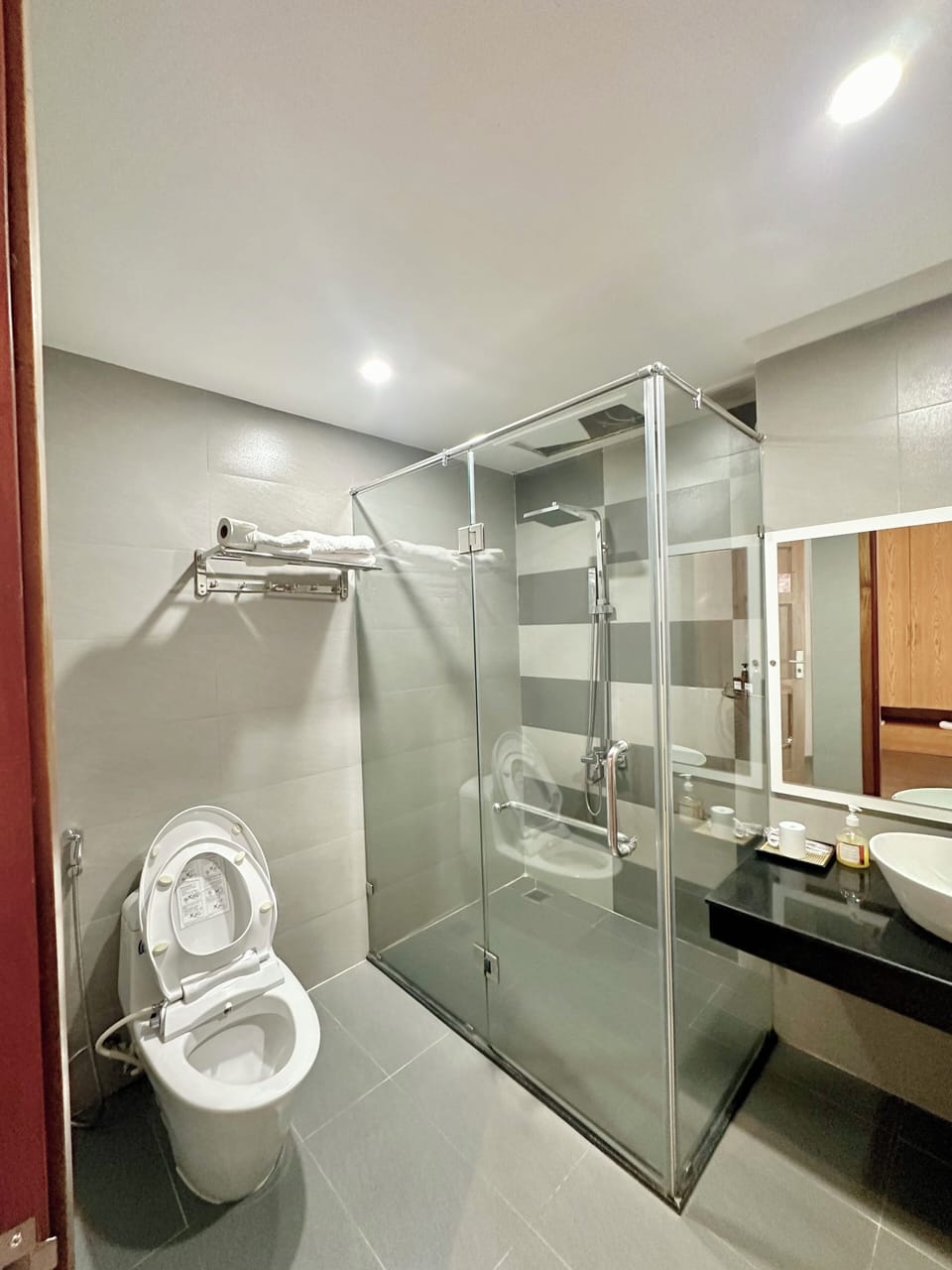 Premium bedding, desk, laptop workspace, blackout drapes