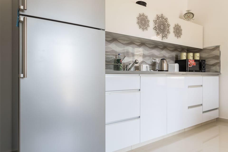 Comfort Apartment, 1 Bedroom | Private kitchen | Full-size fridge, microwave, stovetop, coffee/tea maker