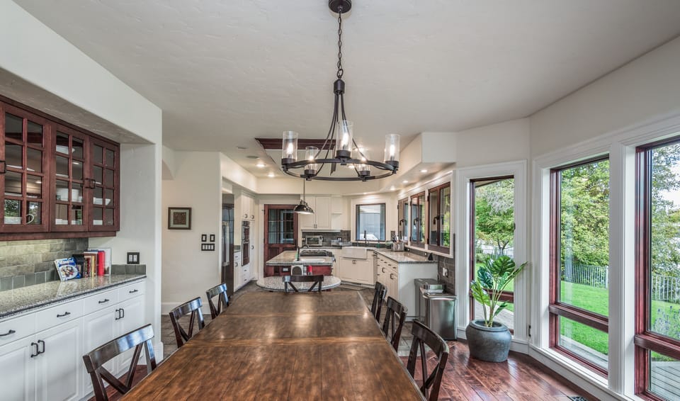 Open kitchen, dining, living with views of Mirror Pond, Drake Park, Old Bend.