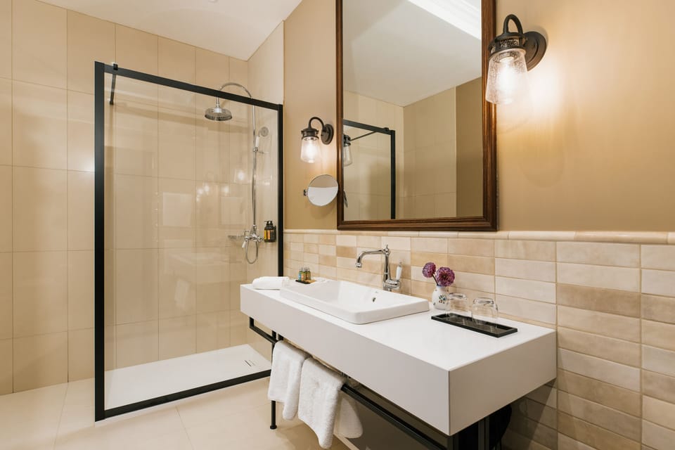Combined shower/tub, designer toiletries, hair dryer, bathrobes