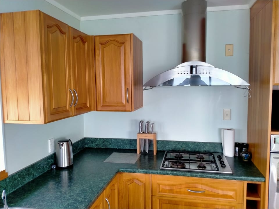 Kitchen with gas hob and wall oven