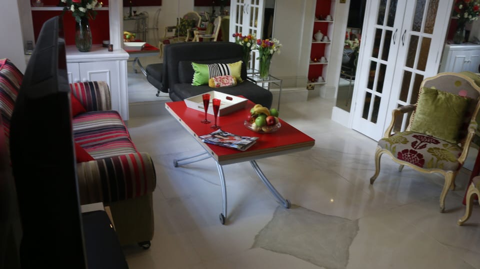 Marble floor with white wood surrounds
