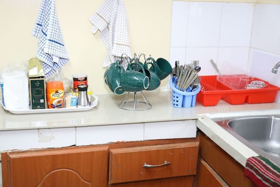 Comfort Apartment, Non Smoking | Private kitchen | Full-size fridge, microwave, oven, stovetop