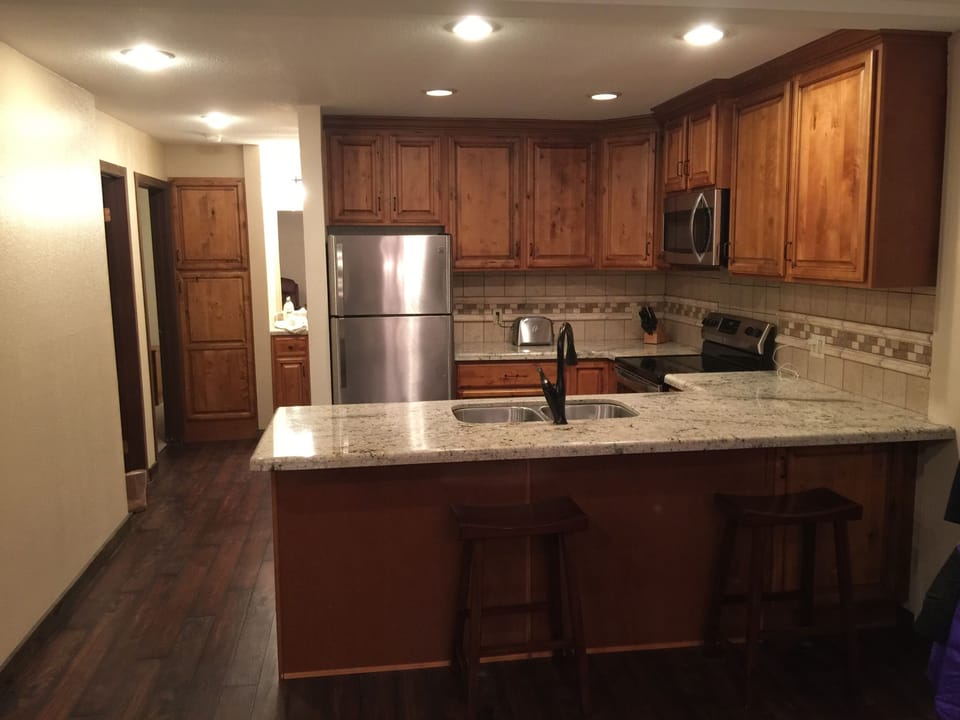 Kitchen with hallway leading to bedrooms.