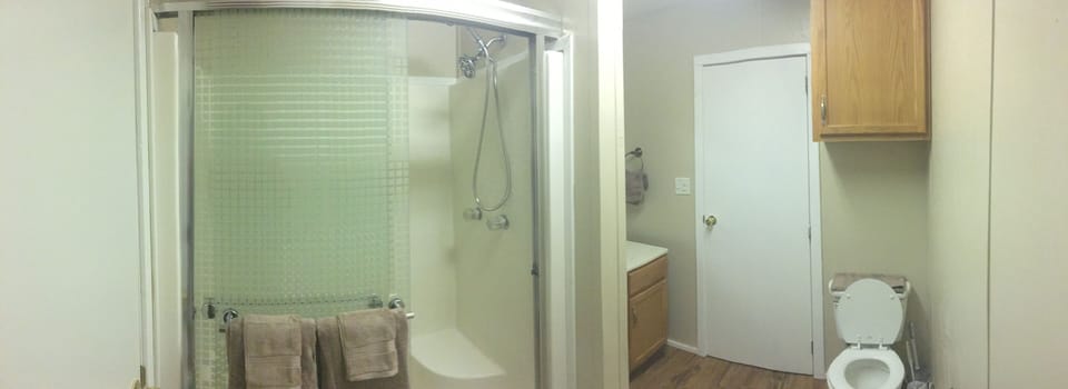 Adjoining bathroom with large walk-in shower