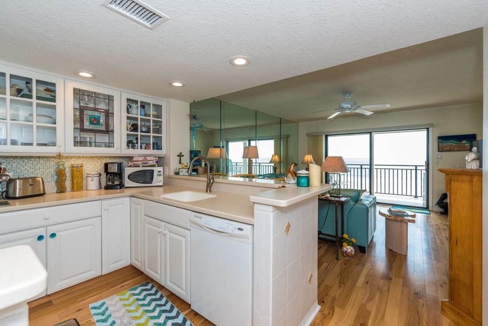  View  of kitchen to living room of ocean to east and intracoastal to west. 