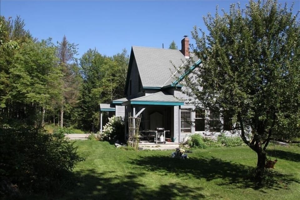 A side view captures a deck off the kitchen, perfect for bbq and outdoor meals