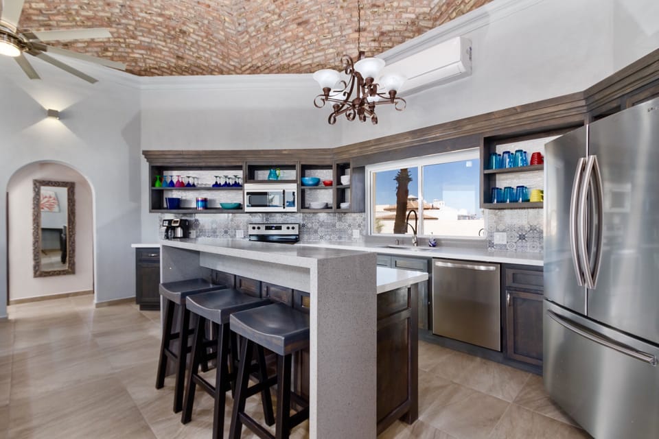 Gorgeous, modern, fully equipped kitchen with island bar and 3 stools.