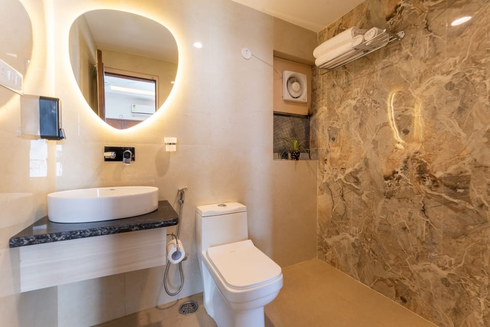 Shower, bathrobes, bidet, toilet paper