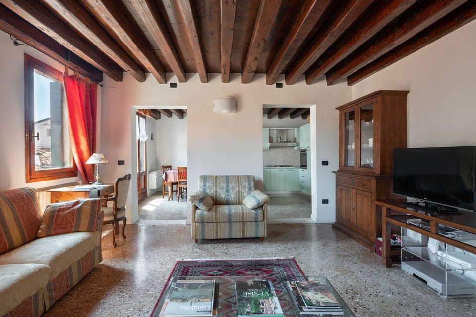 Apartment, 2 Bedrooms | Living room | 26-inch flat-screen TV with cable channels, TV, DVD player