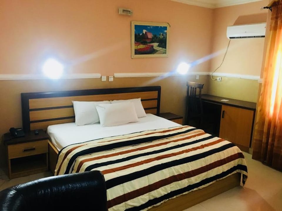 In-room safe, desk, laptop workspace, bed sheets