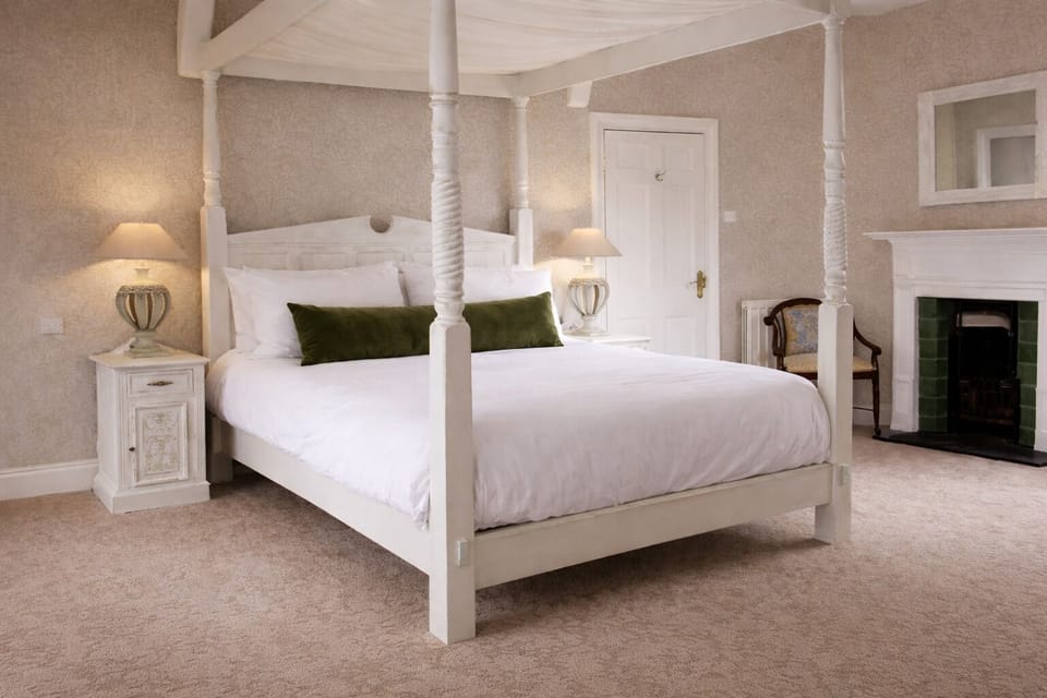 Select Room | Premium bedding, desk, iron/ironing board, free cribs/infant beds