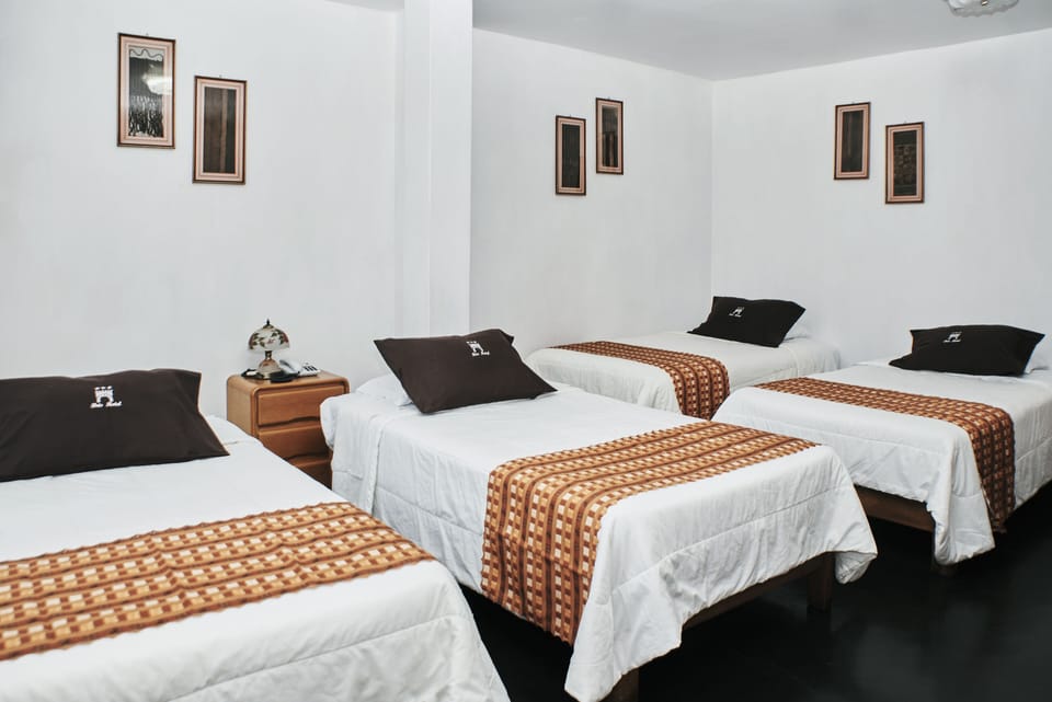 Quadruple Room | Down comforters, Select Comfort beds, desk, laptop workspace