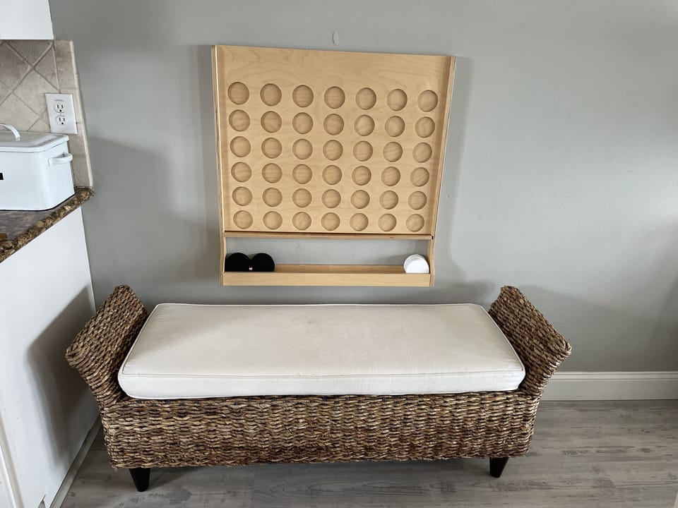 wall mounted Connect 4 with sitting bench