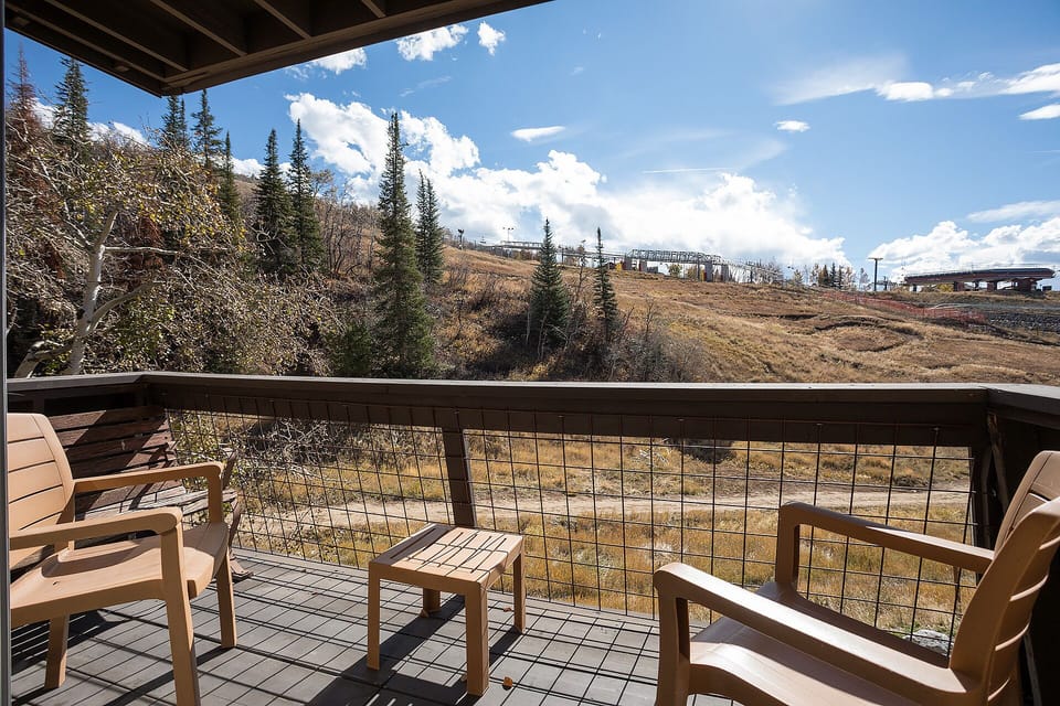 Unwind on your private balcony with comfortable seating while soaking in sweeping mountain views and crisp alpine air.