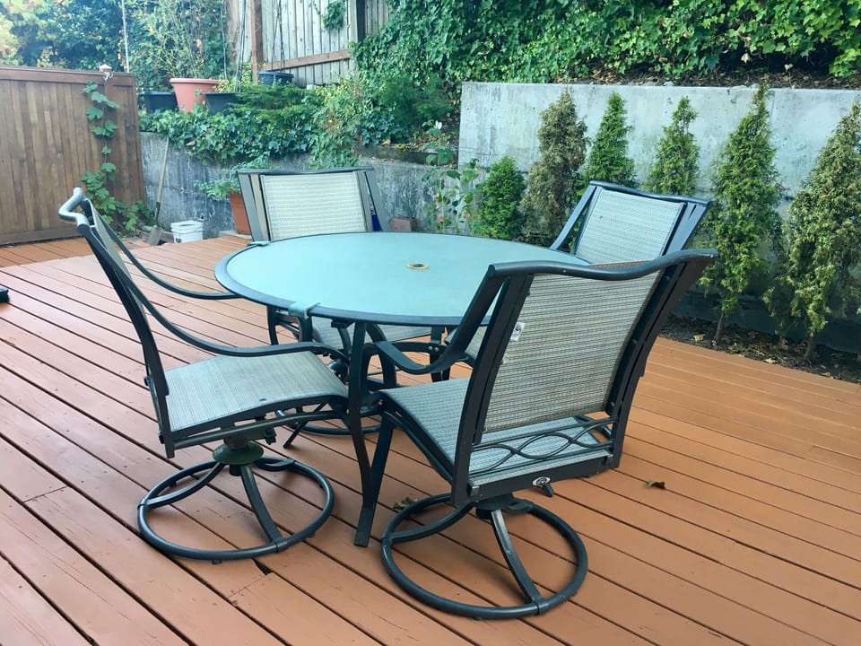 The very private back patio deck,  table, and hammock, are yours to use.