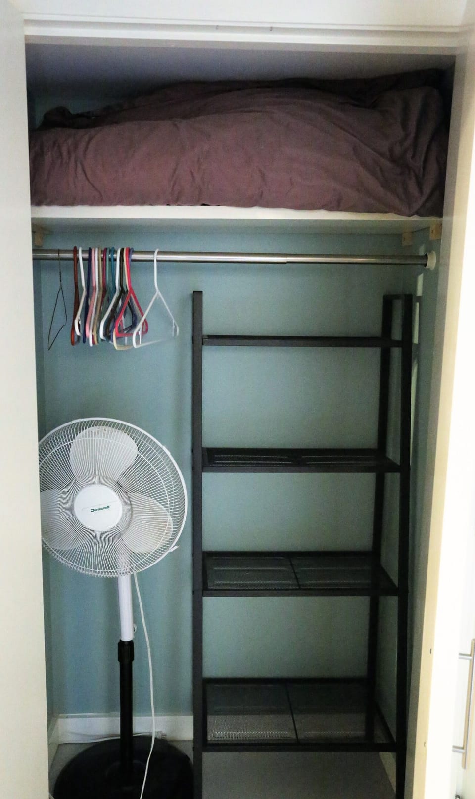 The closet shelves and hangars are all yours - extra bedding too! 