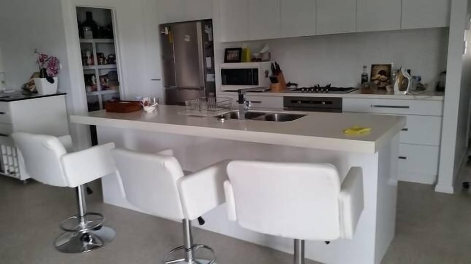 Comfy Bar Stools for Breakfast or Drinks. Microwave for heating food. 