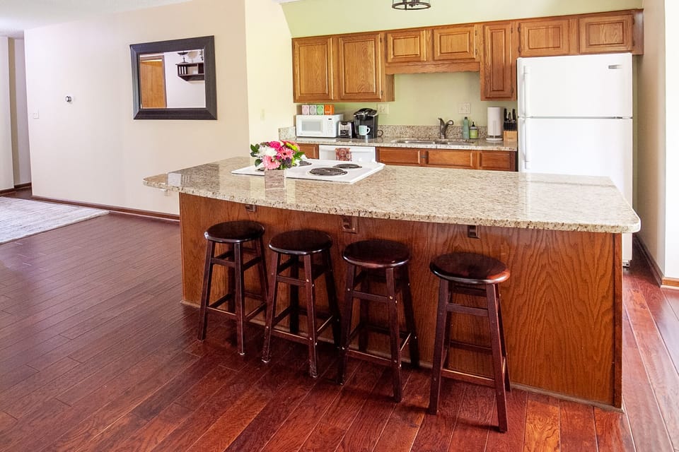 Granite countertops, Bar seating for 4, dishwasher, stove, refrigerator 