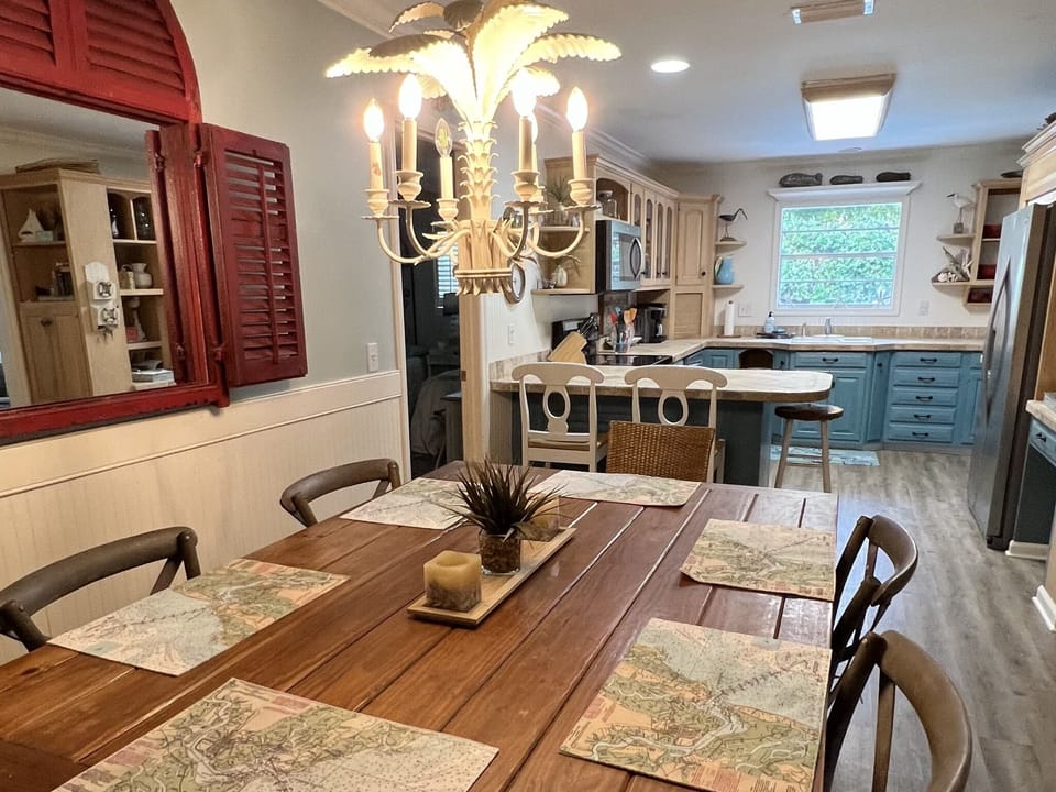 Large dining table can seat eight.  Perfect place for family games. 