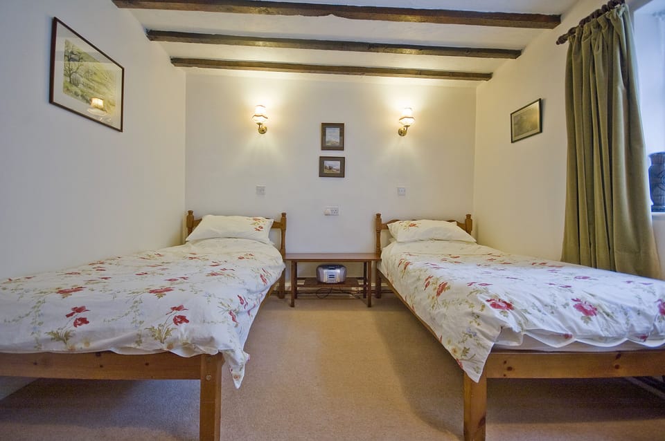 Ground floor twin bedroom. An additional double sofa bed in the lounge upstairs.