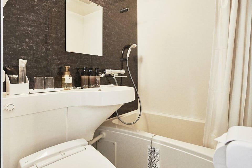 Shower, free toiletries, hair dryer, slippers