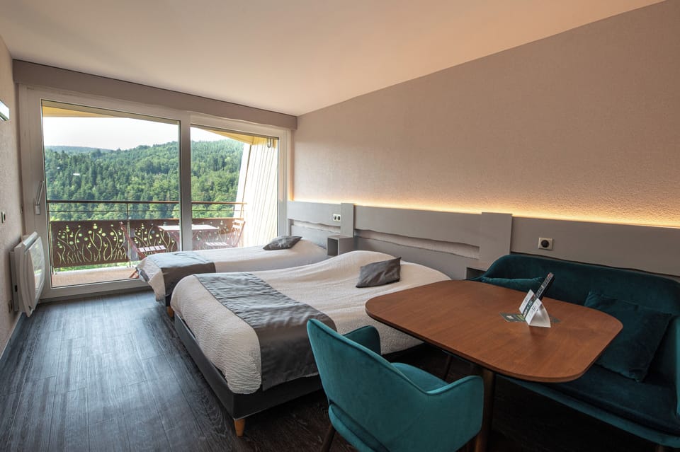Panoramic Triple Room, Balcony | Individually decorated, desk, laptop workspace, blackout drapes
