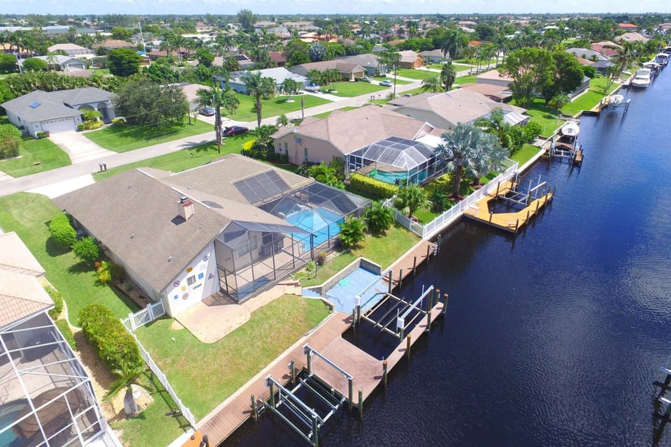 Enjoy your own little slice of paradise in this Southwest Cape Coral pool home located on a Gulf access canal. Boat lift not accessible!