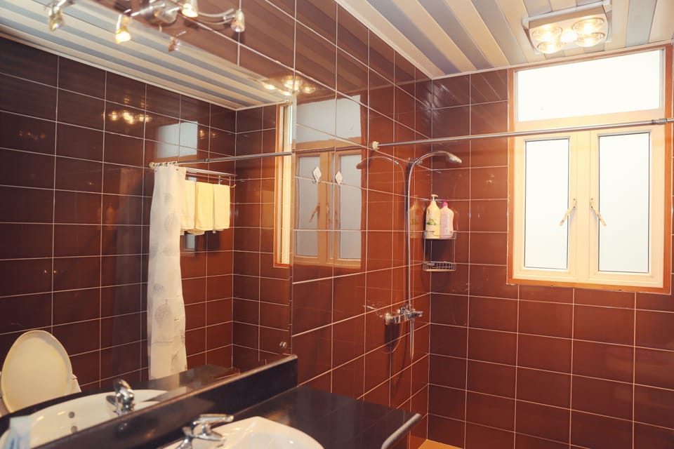 Shower, free toiletries, slippers, towels