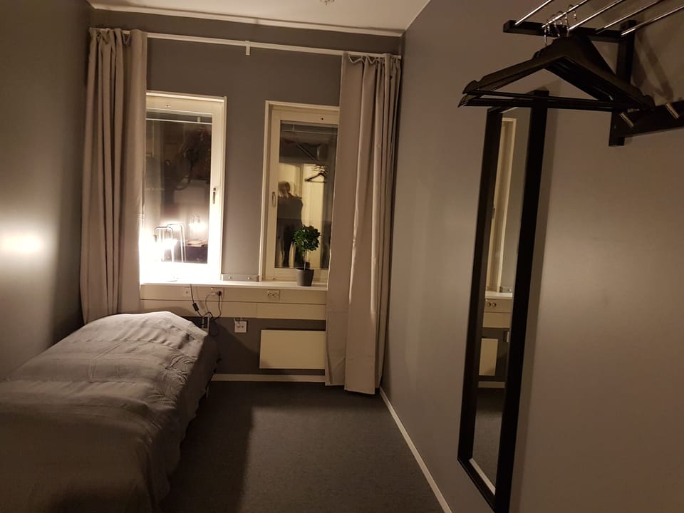 Single Room, Shared Bathroom | Blackout drapes, iron/ironing board, free WiFi, bed sheets