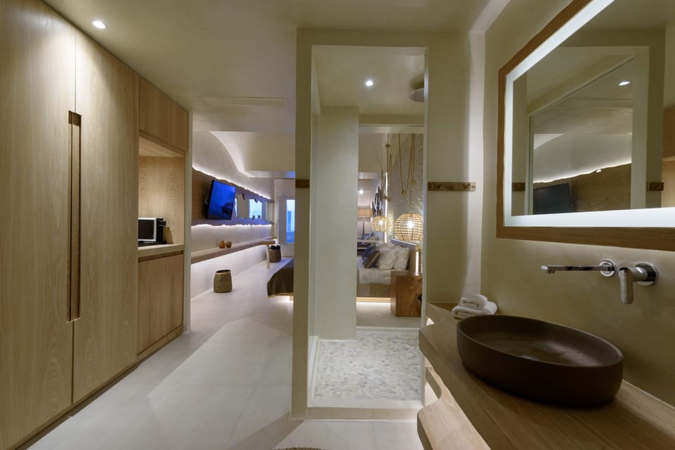 Luxury Suite, Hot Tub, Sea View | Bathroom amenities | Shower, rainfall showerhead, free toiletries, hair dryer