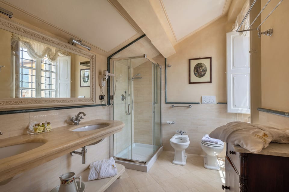 Exclusive Suite, 1 Queen Bed, Garden View | Bathroom | Shower, hair dryer, slippers, bidet