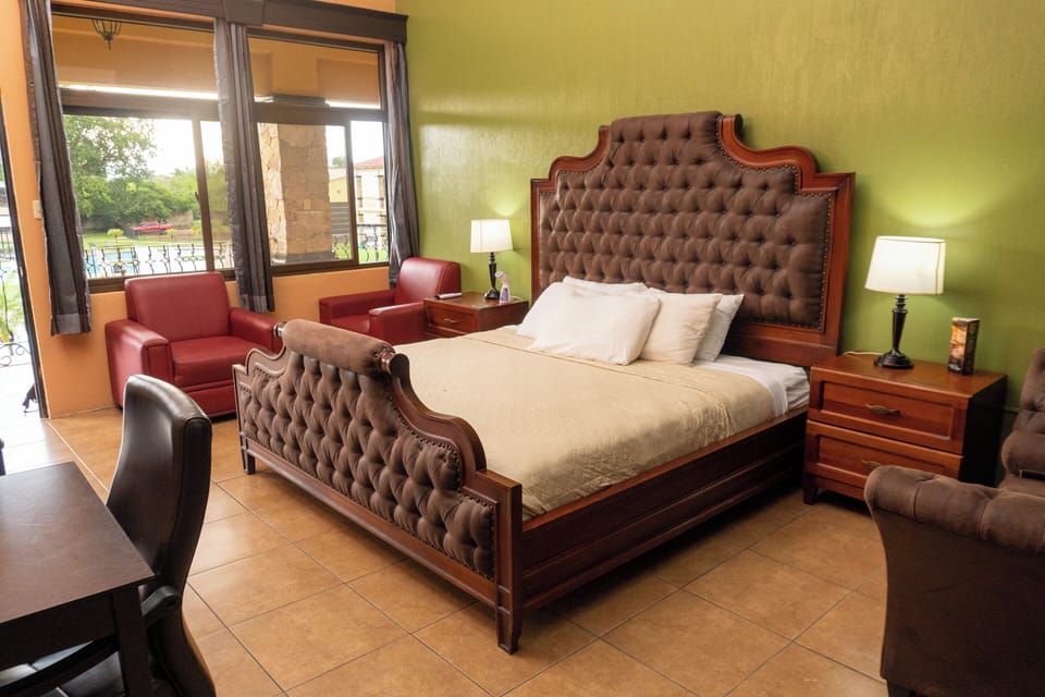 Deluxe Room, Pool View | Desk, bed sheets