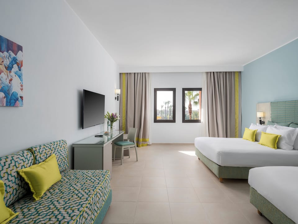 Standard Triple Room, Pool View | Minibar, in-room safe, blackout drapes, soundproofing