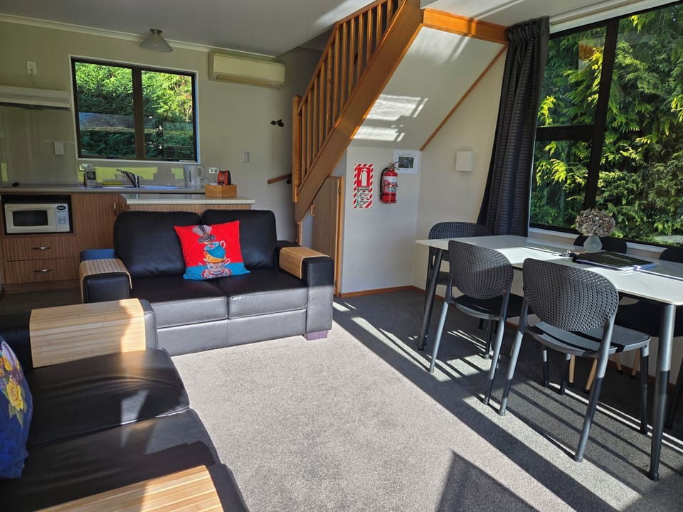 2 Bedroom Self-Contained Cottage | Living area | Flat-screen TV, toys
