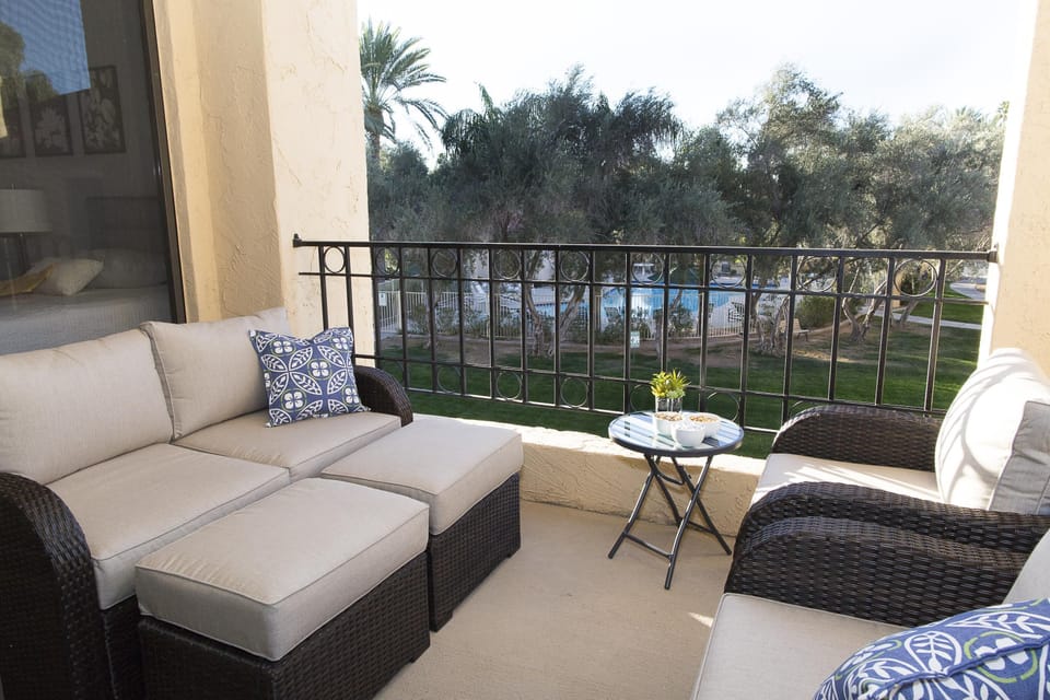 Bedroom deck with view of pool