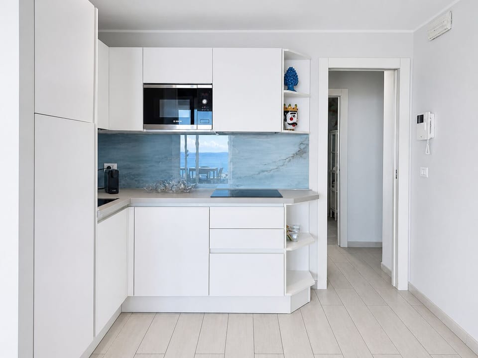 Deluxe Apartment, Hot Tub, Sea View | Private kitchen | Full-size fridge, microwave, stovetop, dishwasher