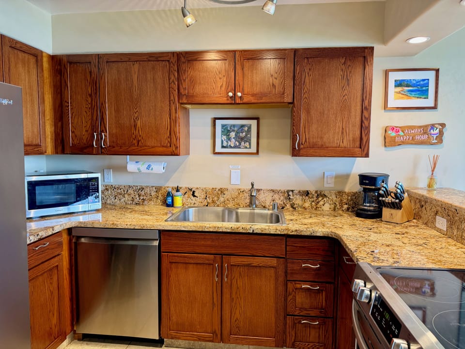 The kitchen boasts granite countertops and stainless steel appliances.