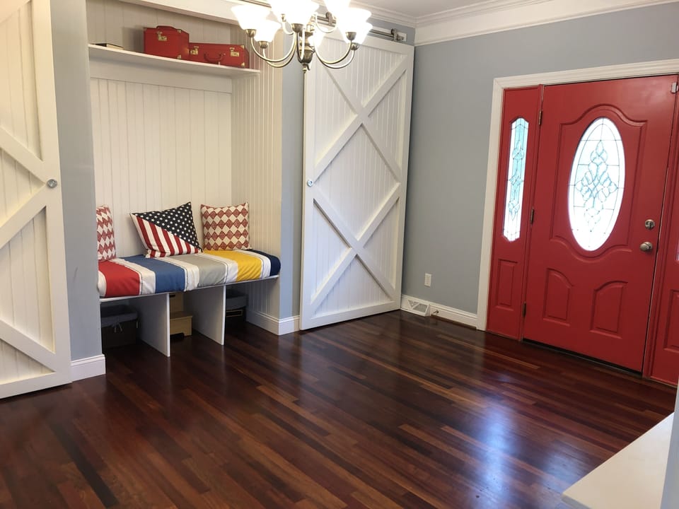 foyer / 2nd dining room (extra chairs and tables behind barn doors) - floor 2