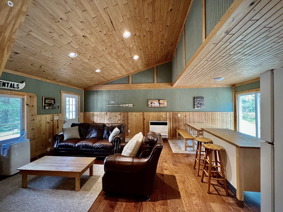 Cozy, comfy, open concept living room, kitchen, and dining area.