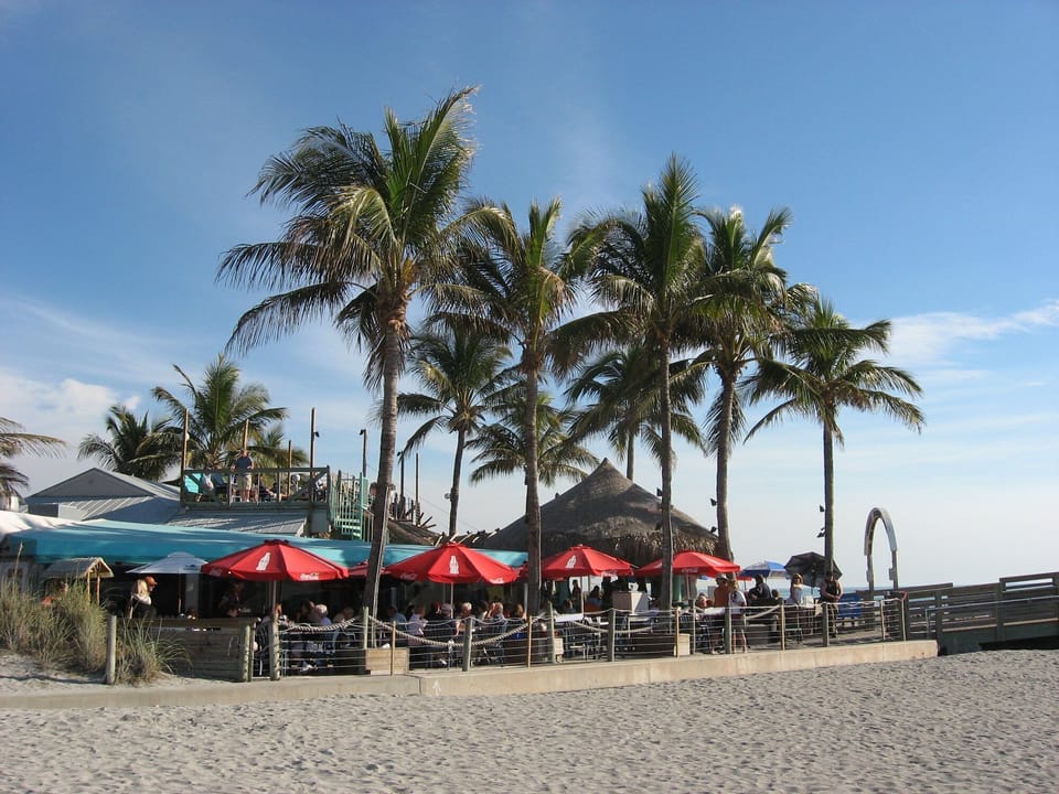 Enjoy a cold drink, snack or more at "Sharky's On The Pier", rated one of the best Beach Bars in Florida