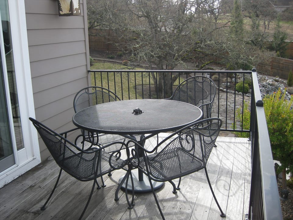 Grill steaks, enjoy a meal or watch the sunset on the large balcony/deck.